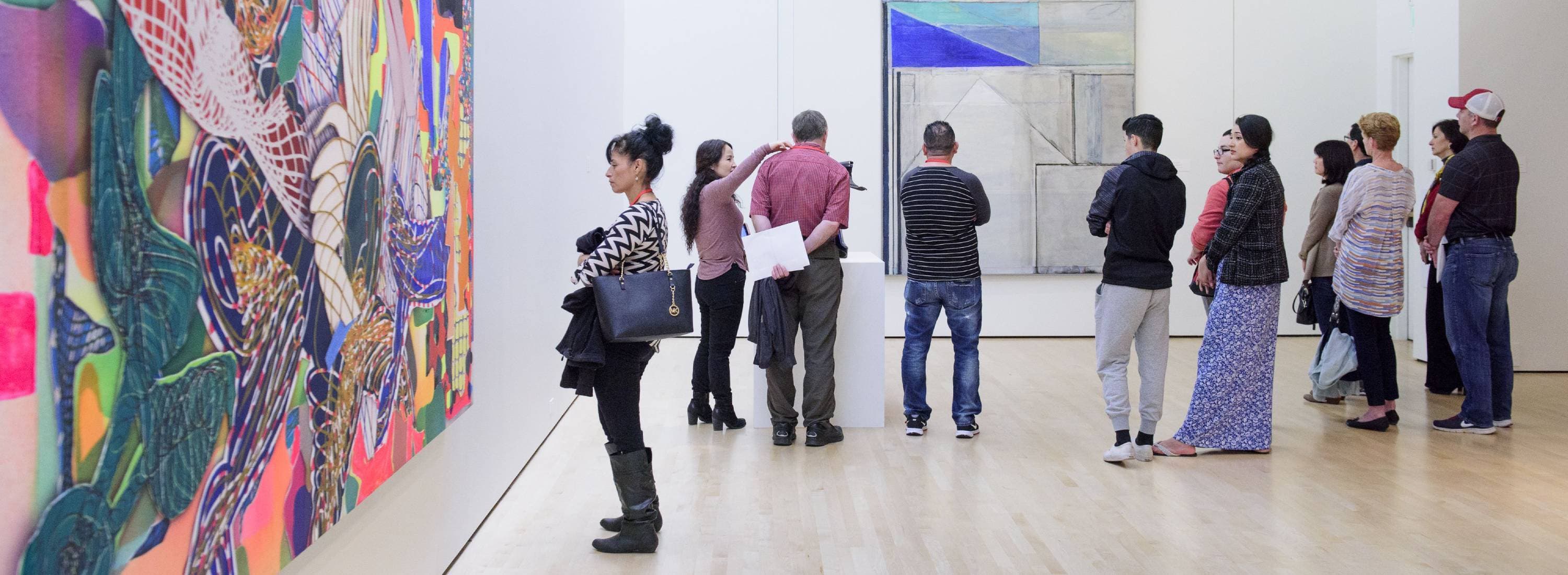 People looking at art in Cantor Arts Center gallery